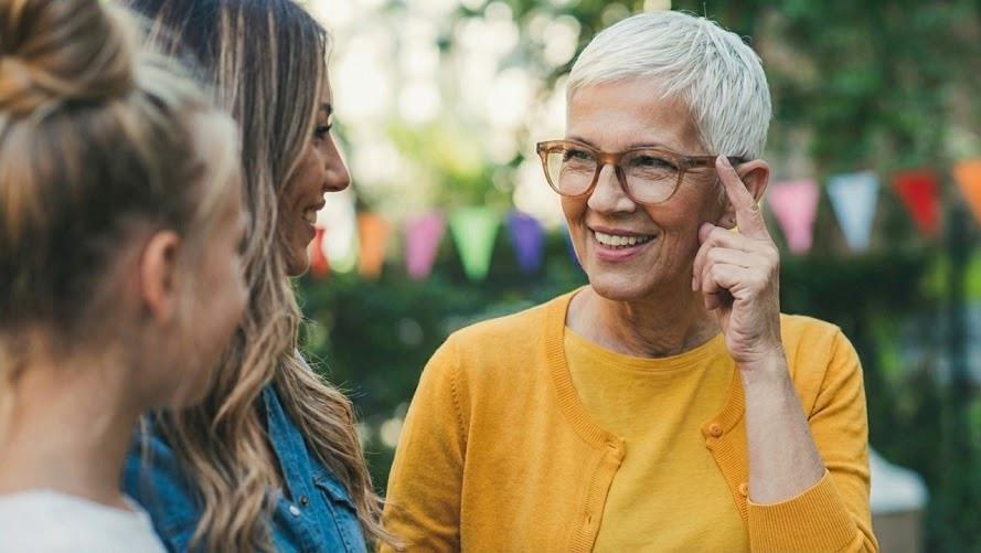 Caregiver and loved one smiling